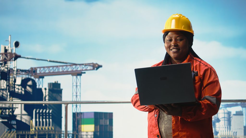 Portrait of cheerful offshore platform engineer managing supply operations
